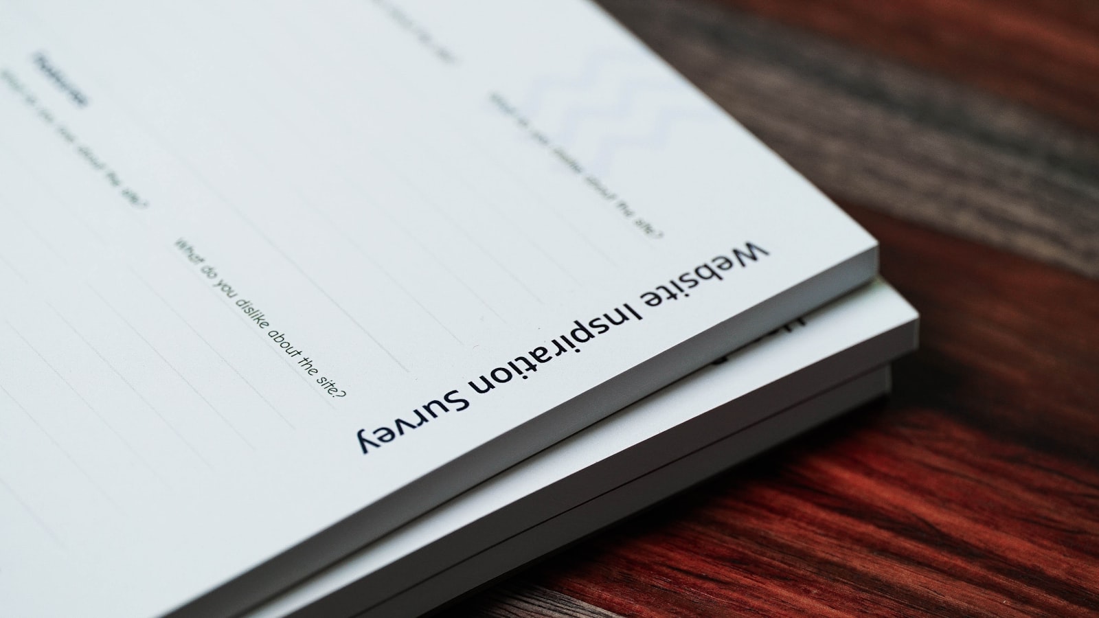 Stack of denied-claim paperwork on a desk